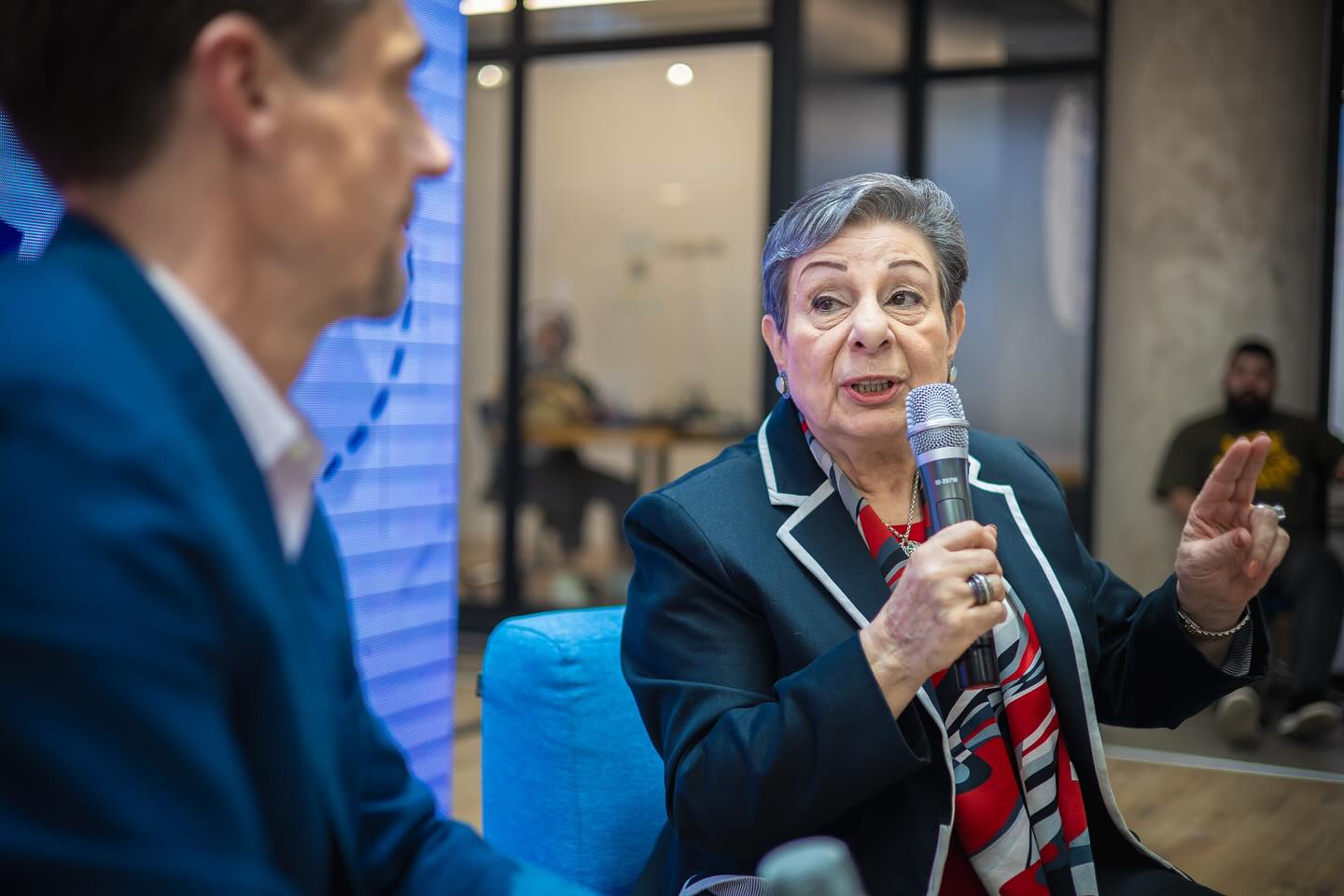 A speaker addressing an audience in the building
