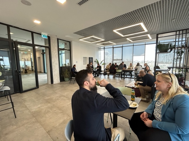 Two people eating together at a table in the cafe