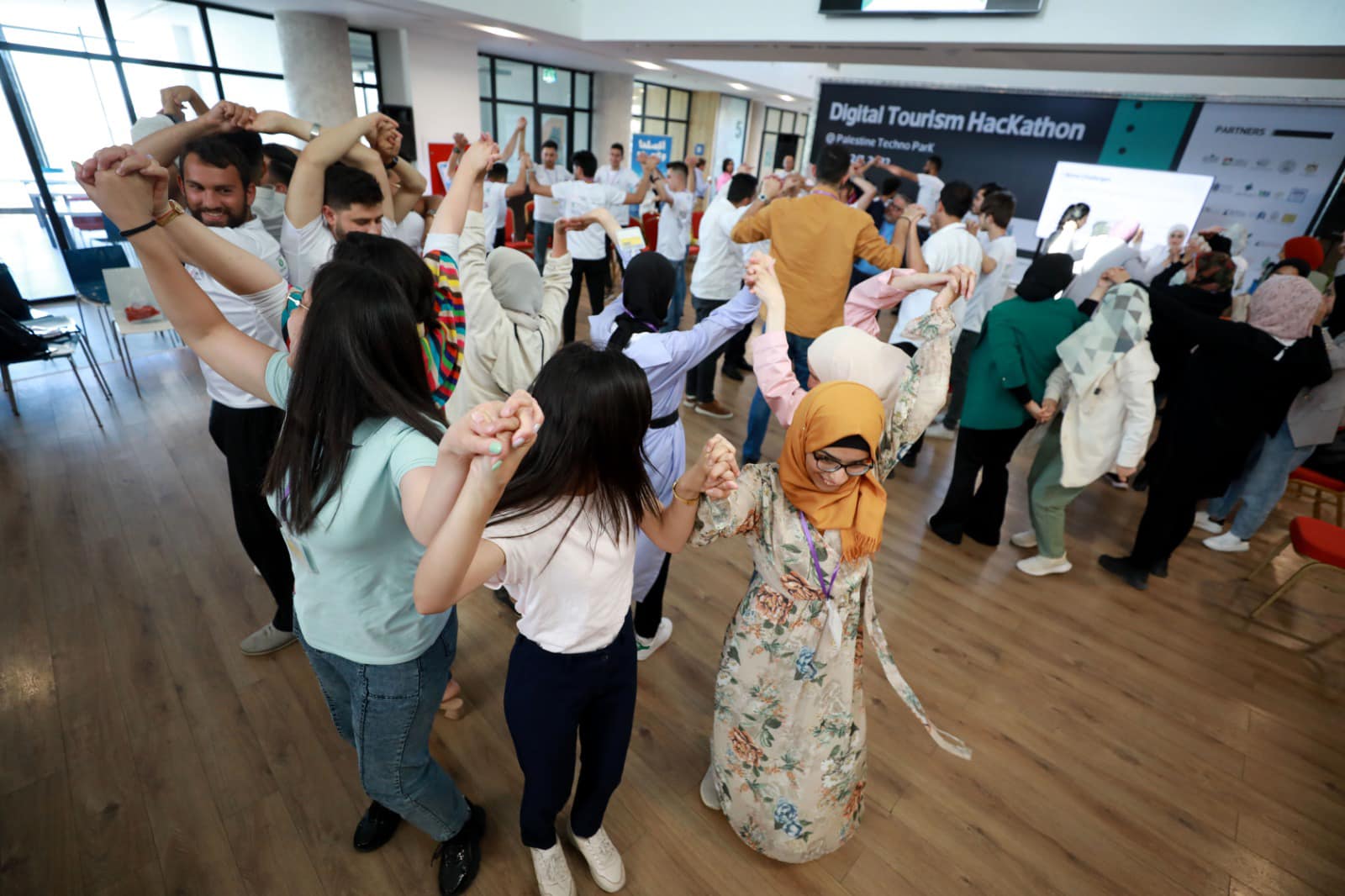 Guests on their feet at an evening event on the same floor
